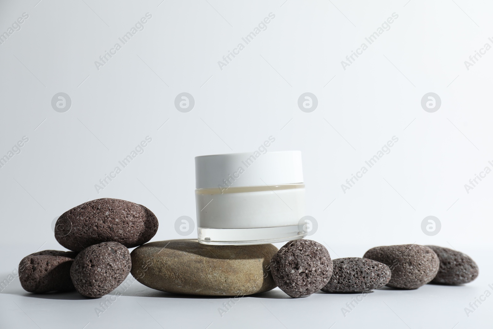 Photo of Stylish presentation of face cream on white background