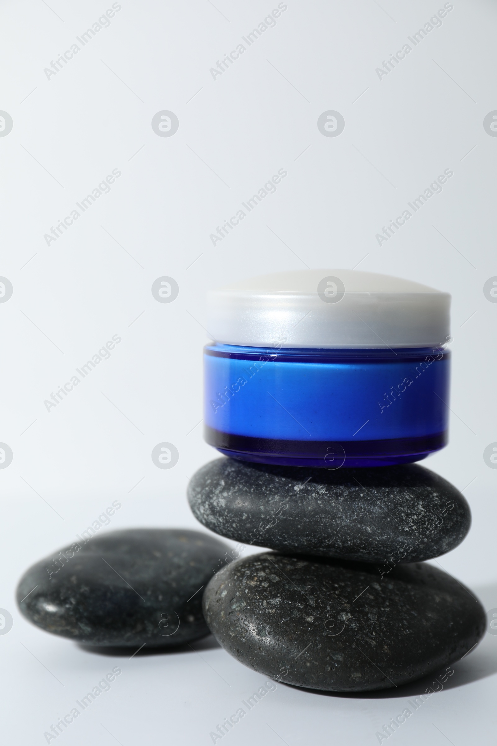 Photo of Stylish presentation of face cream on white background