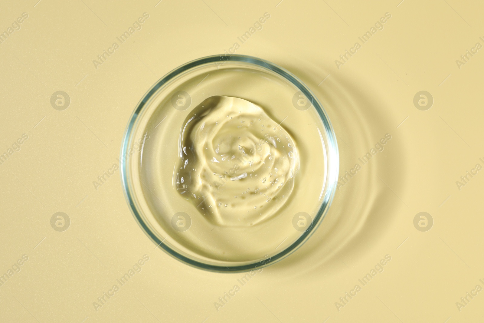 Photo of Petri dish with sample on beige background, top view