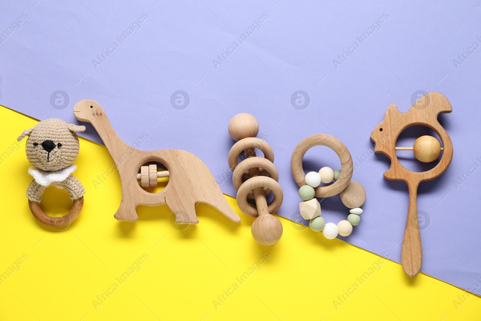 Photo of Different baby rattles on color background, flat lay