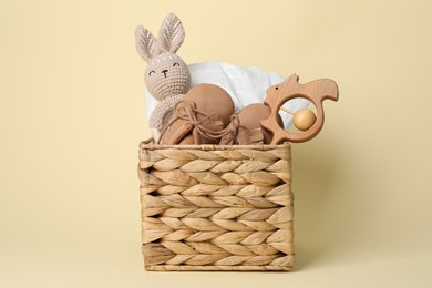 Photo of Baby accessories in box on beige background