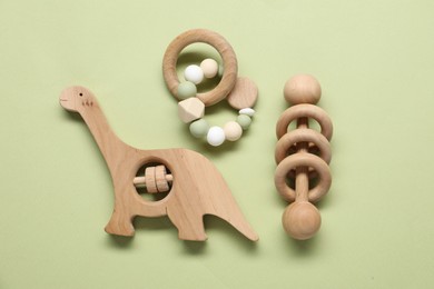 Photo of Different baby rattles on color background, flat lay