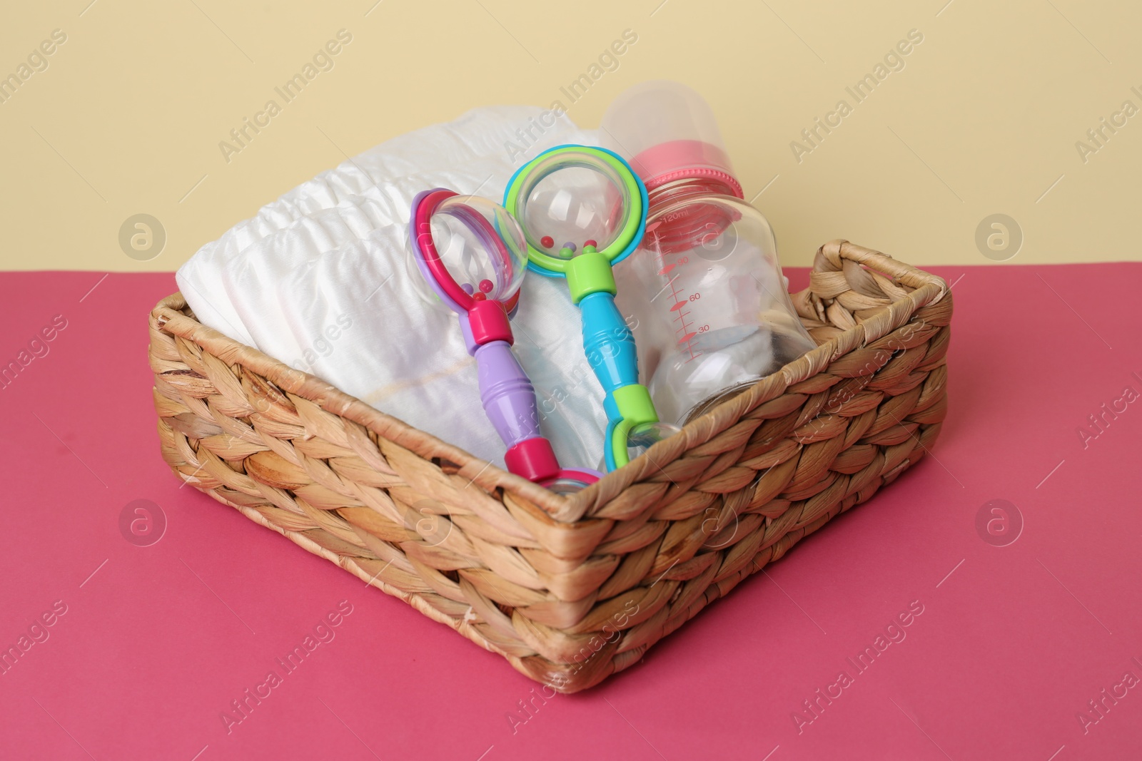 Photo of Baby accessories in box on color background