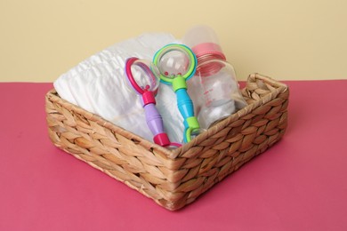 Baby accessories in box on color background