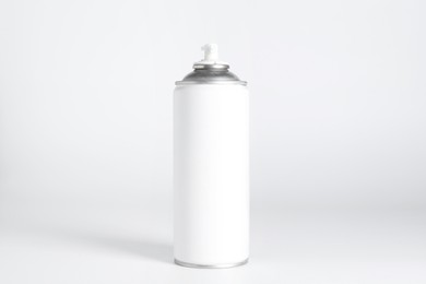 Can of spray paint on white background