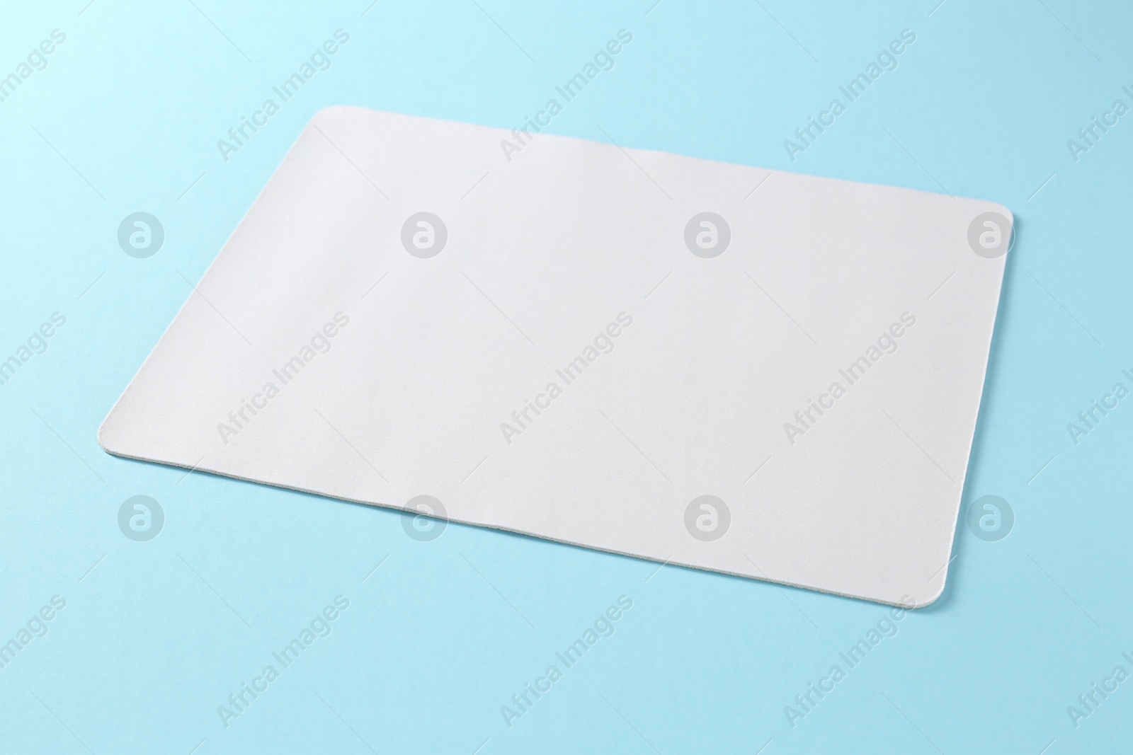 Photo of One mouse pad on light blue background