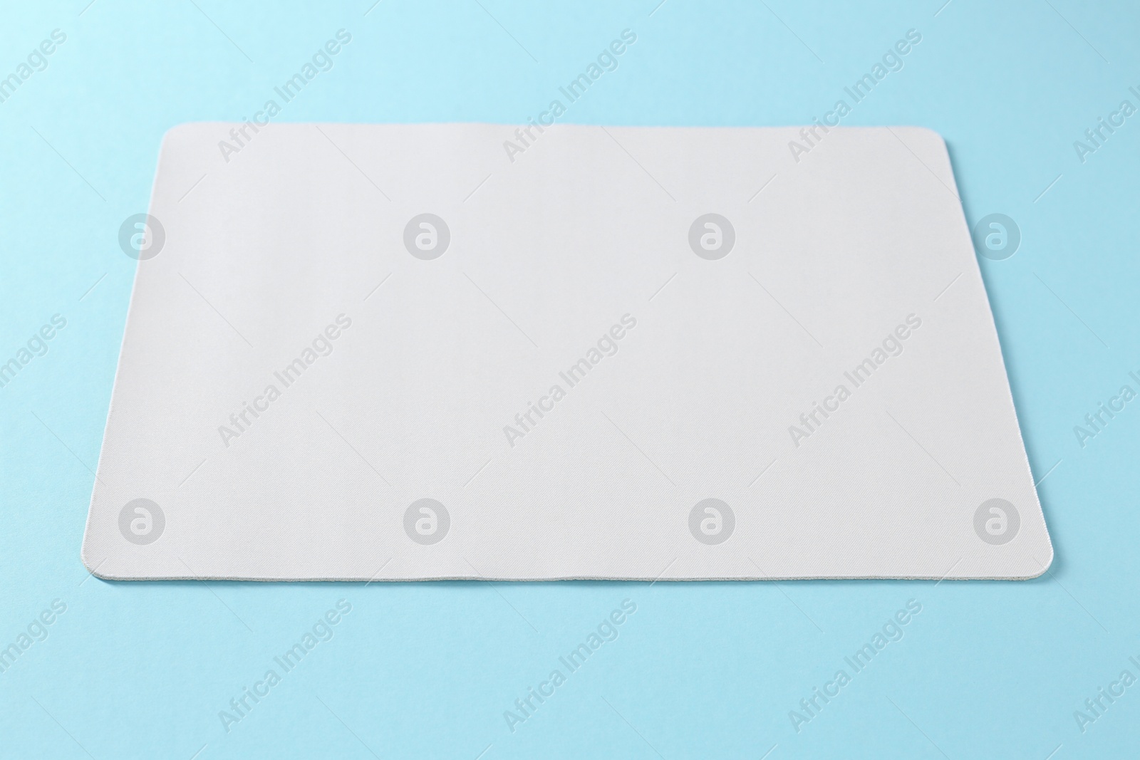 Photo of One mouse pad on light blue background