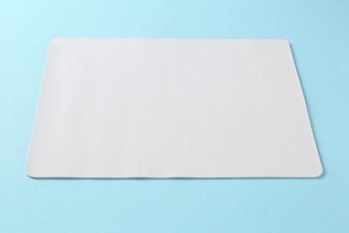 Photo of One mouse pad on light blue background