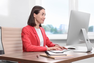 Woman with good posture working in office