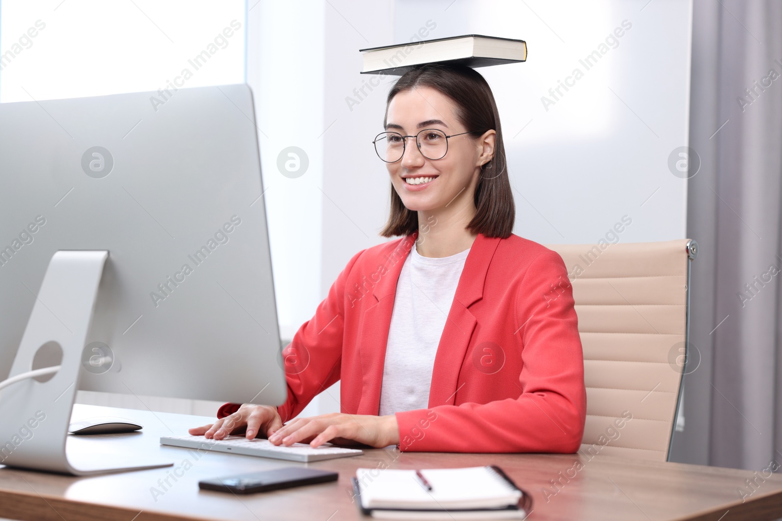 Photo of Woman with good posture working in office