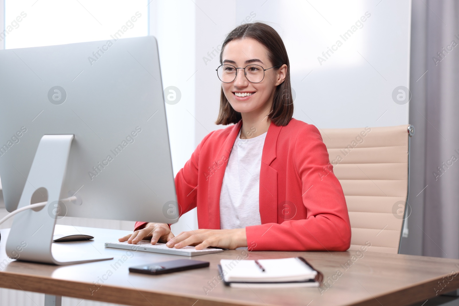 Photo of Woman with good posture working in office