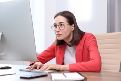 Photo of Woman with poor posture working in office