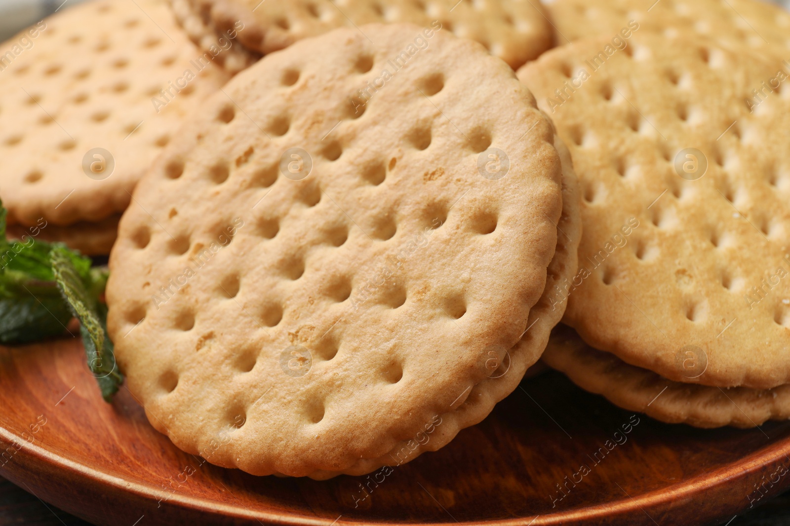 Photo of Fresh tasty sandwich cookies on plate, closeup