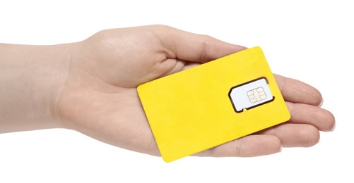 Photo of Woman holding modern SIM card on white background, closeup