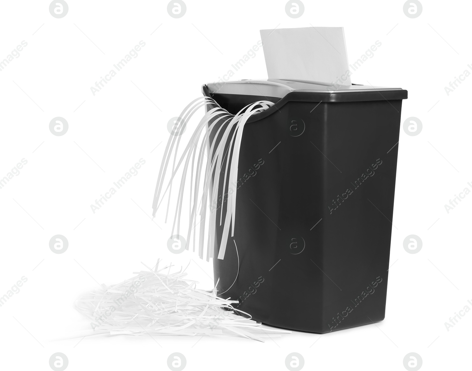 Photo of Destroying sheet of paper with shredder on white background