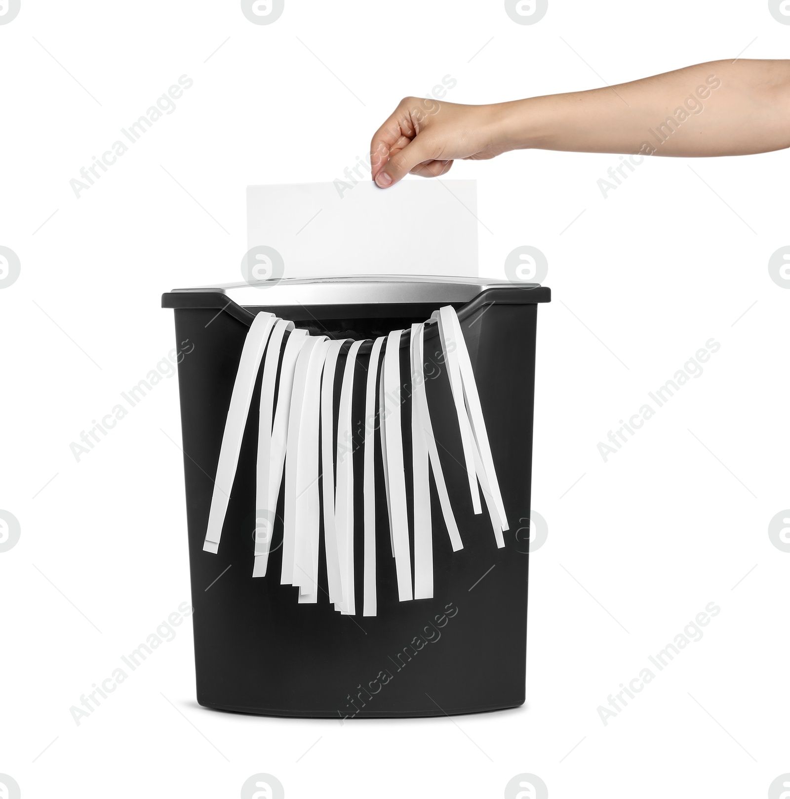 Photo of Woman destroying sheet of paper with shredder on white background, closeup