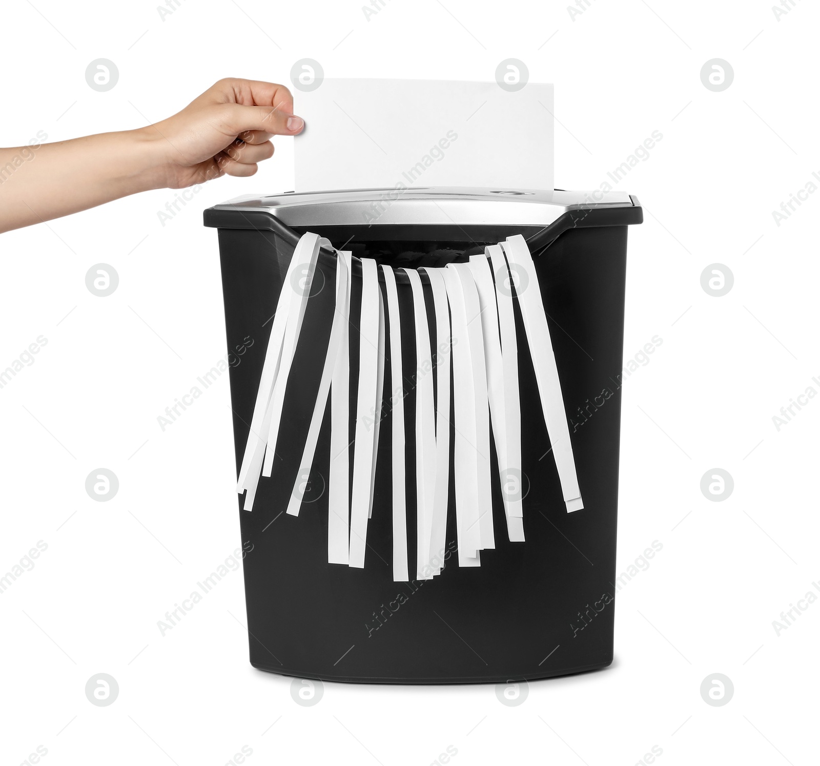 Photo of Woman destroying sheet of paper with shredder on white background, closeup