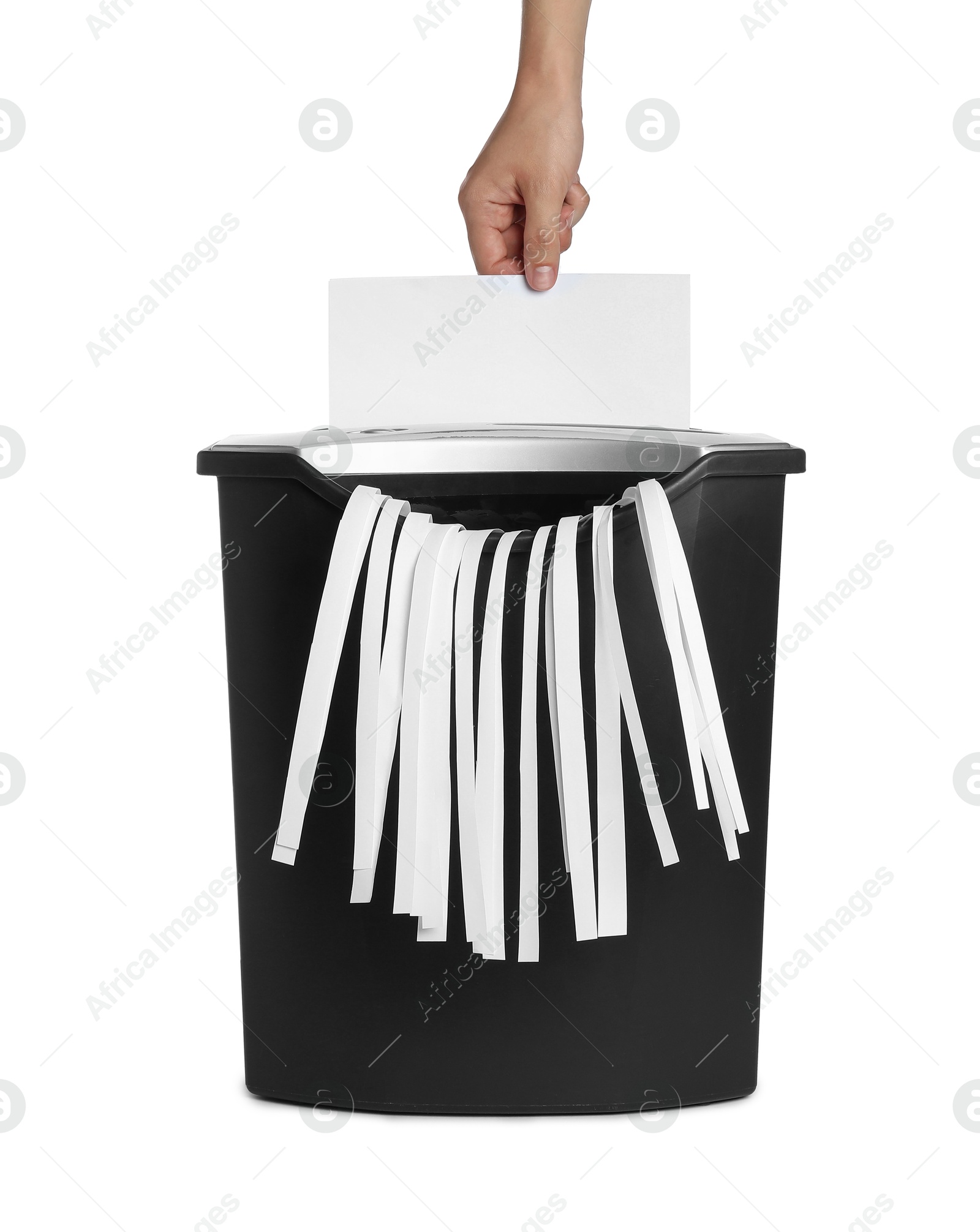 Photo of Woman destroying sheet of paper with shredder on white background, closeup