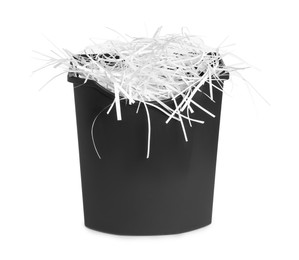 Shredded paper strips in basket isolated on white