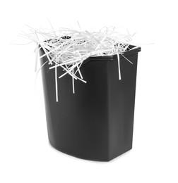 Photo of Shredded paper strips in basket isolated on white