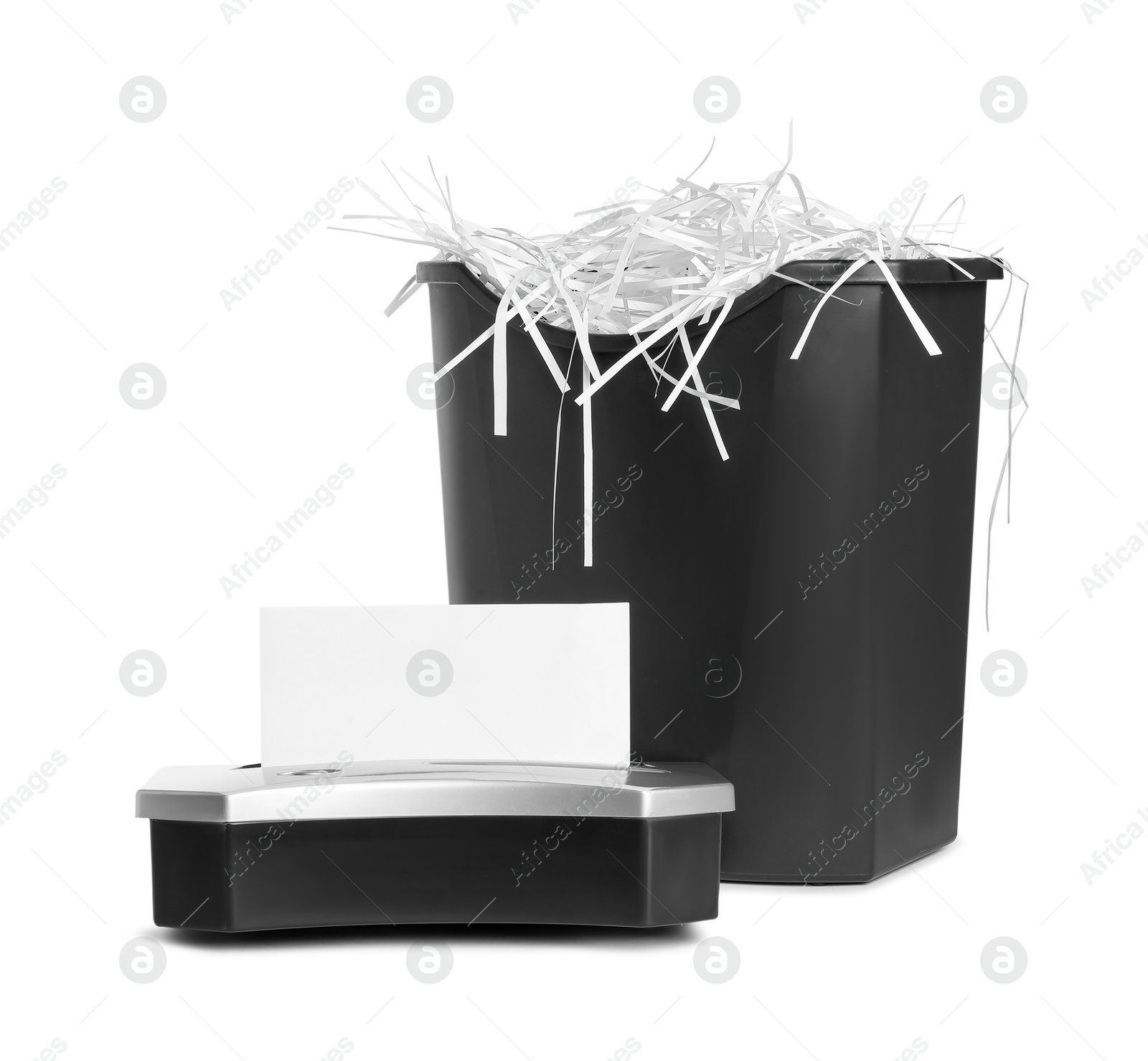 Photo of Shredder, basket and paper strips isolated on white