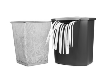 Photo of Shredder, metal basket and paper strips on white background