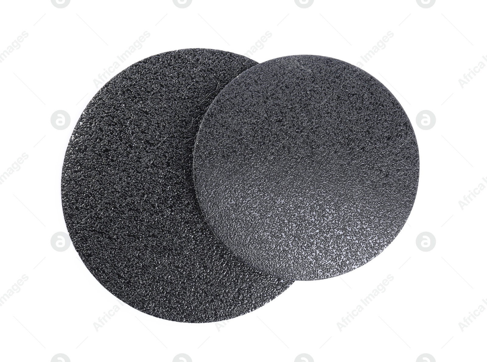 Photo of Coarse sandpaper disks isolated on white, top view