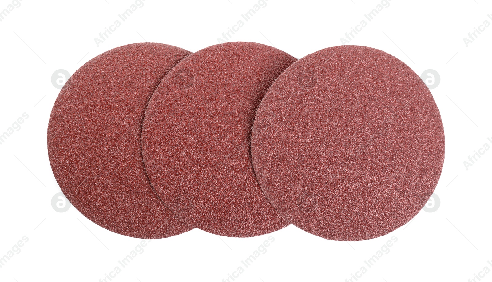 Photo of Coarse sandpaper disks isolated on white, top view