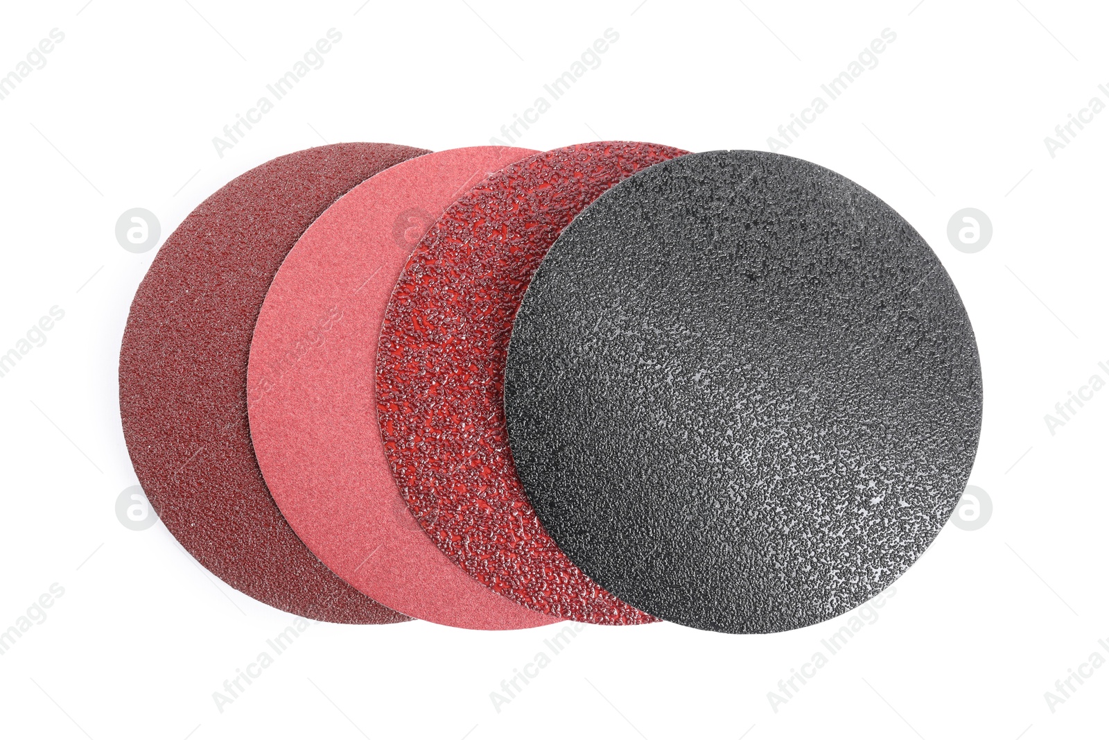 Photo of Coarse sandpaper disks isolated on white, top view