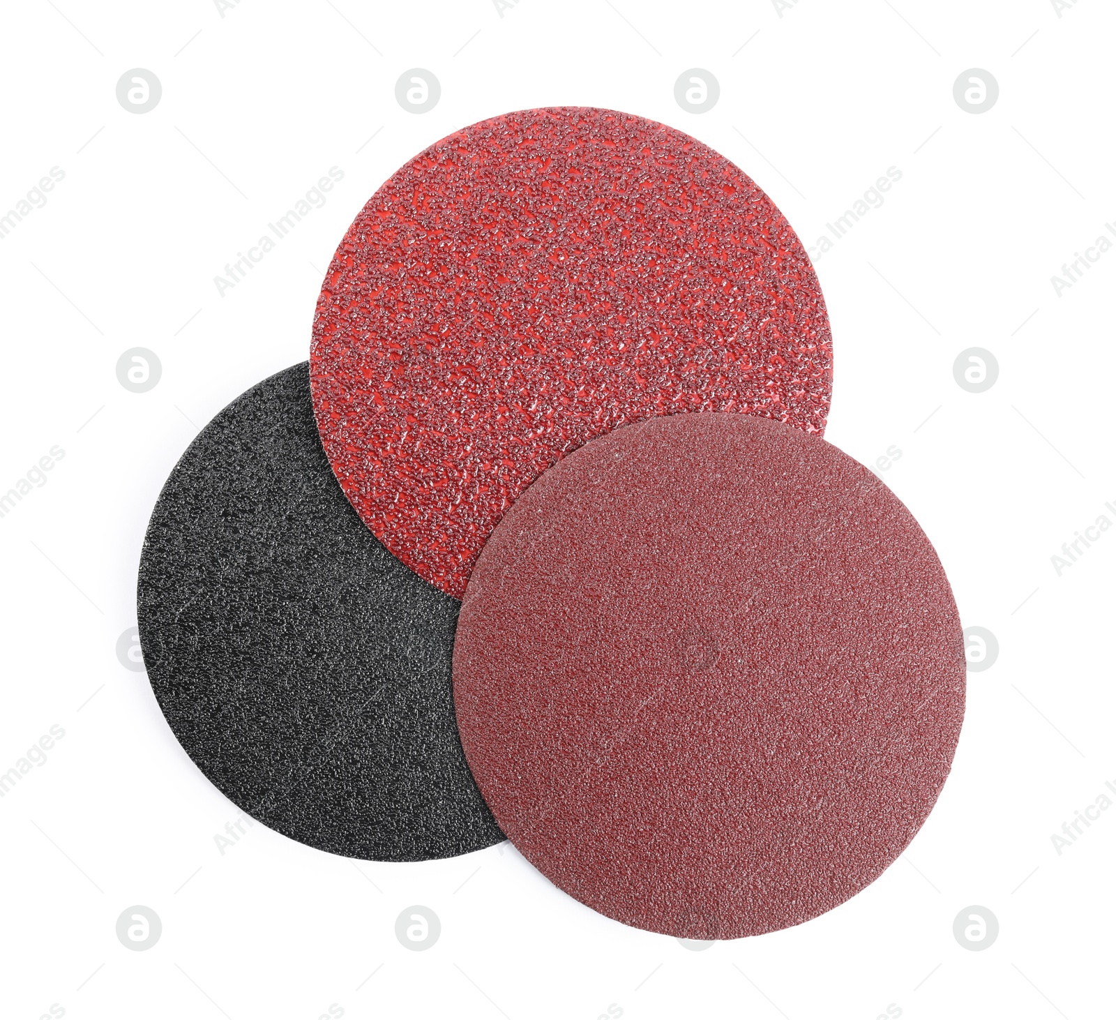 Photo of Coarse sandpaper disks isolated on white, top view