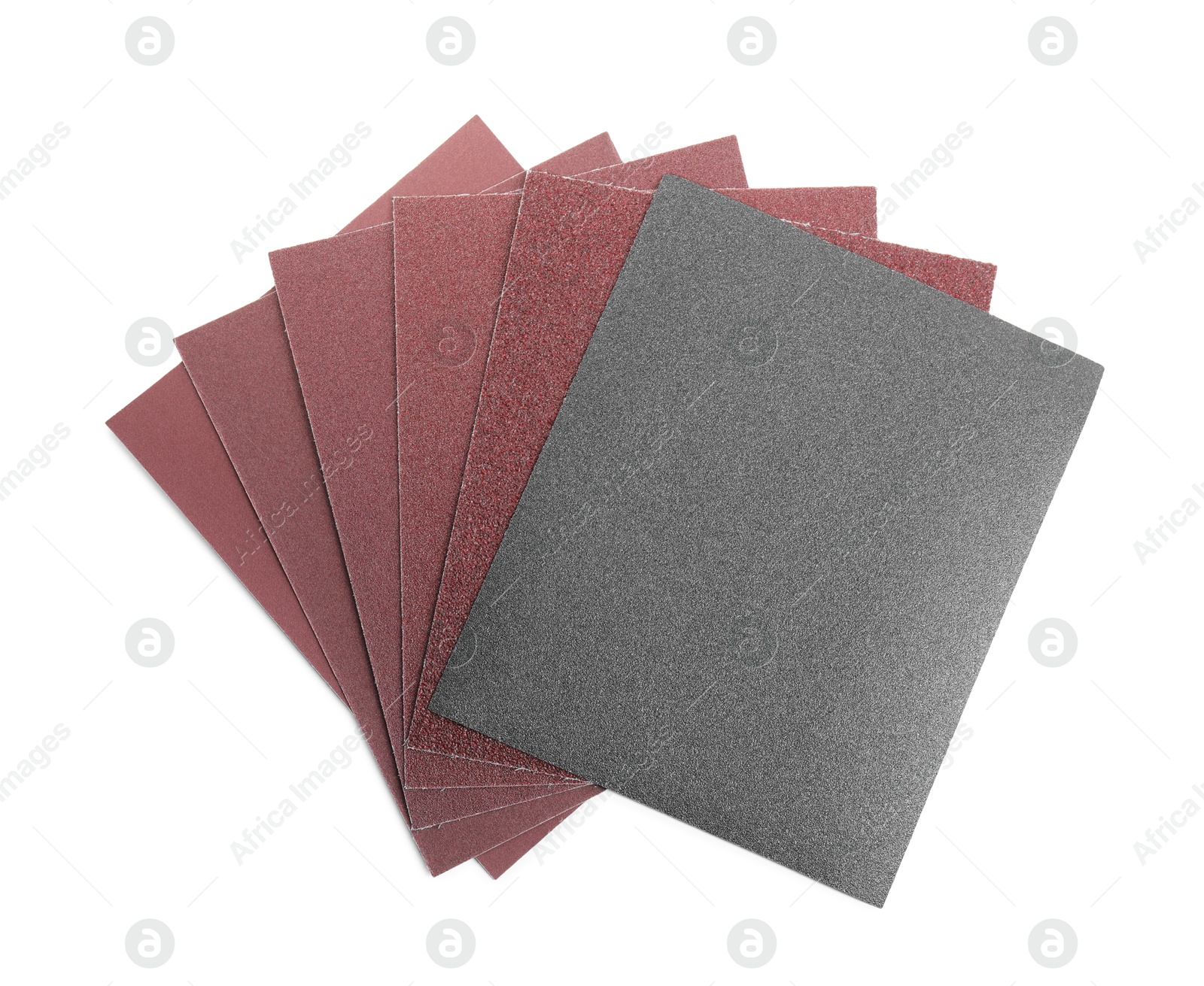 Photo of Sheets of sandpaper isolated on white, top view