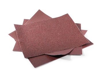 Photo of Many sheets of sandpaper isolated on white