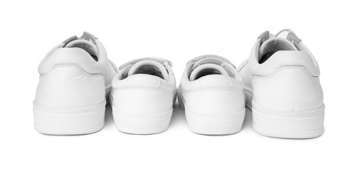 Big and small sneakers isolated on white