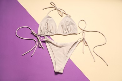 Beautiful swimsuit on color background, flat lay