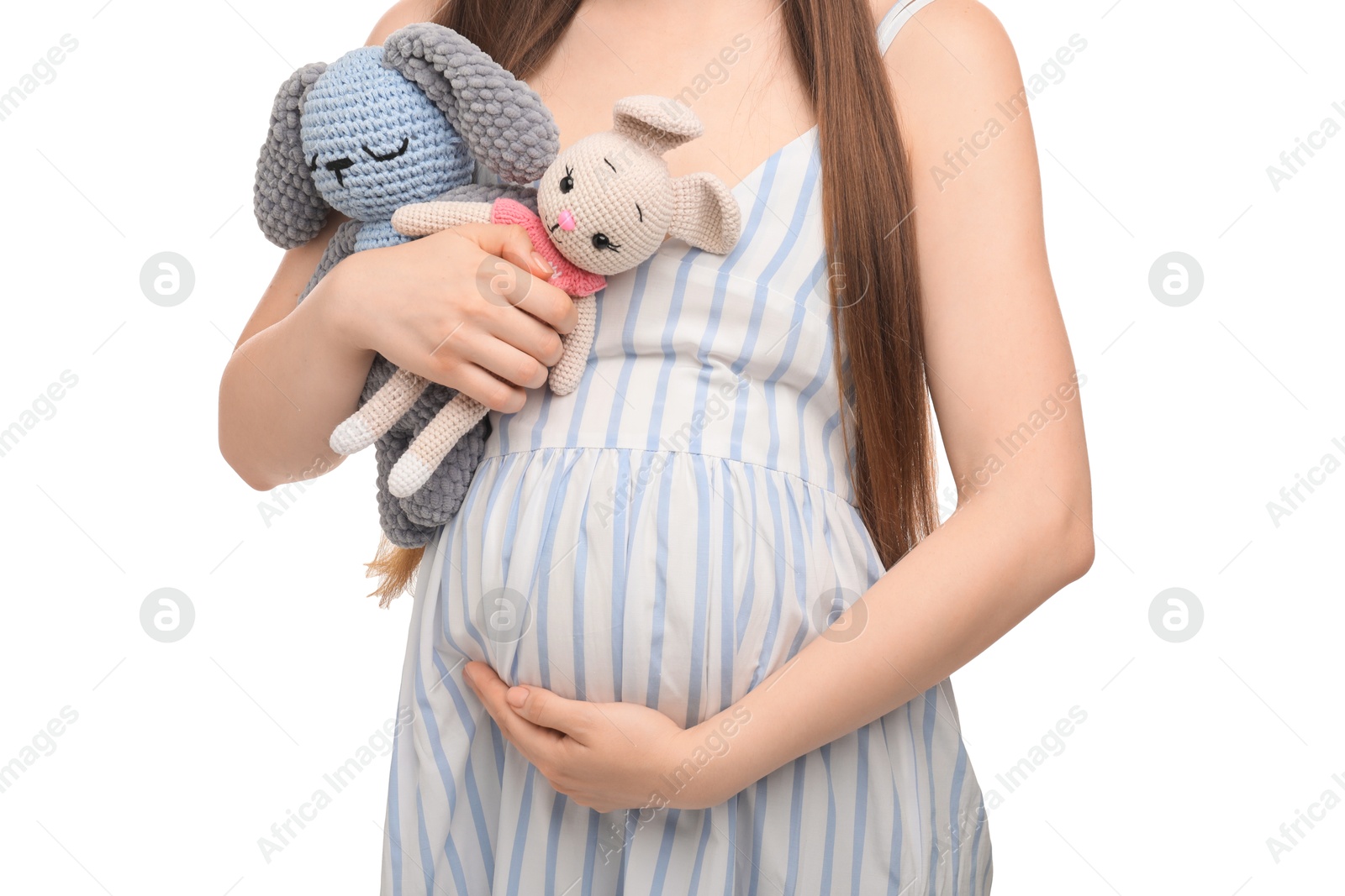 Photo of Expecting twins. Pregnant woman holding two toys on white background, closeup