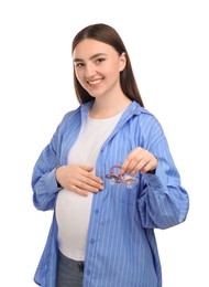 Photo of Expecting twins. Pregnant woman holding two pacifiers on white background