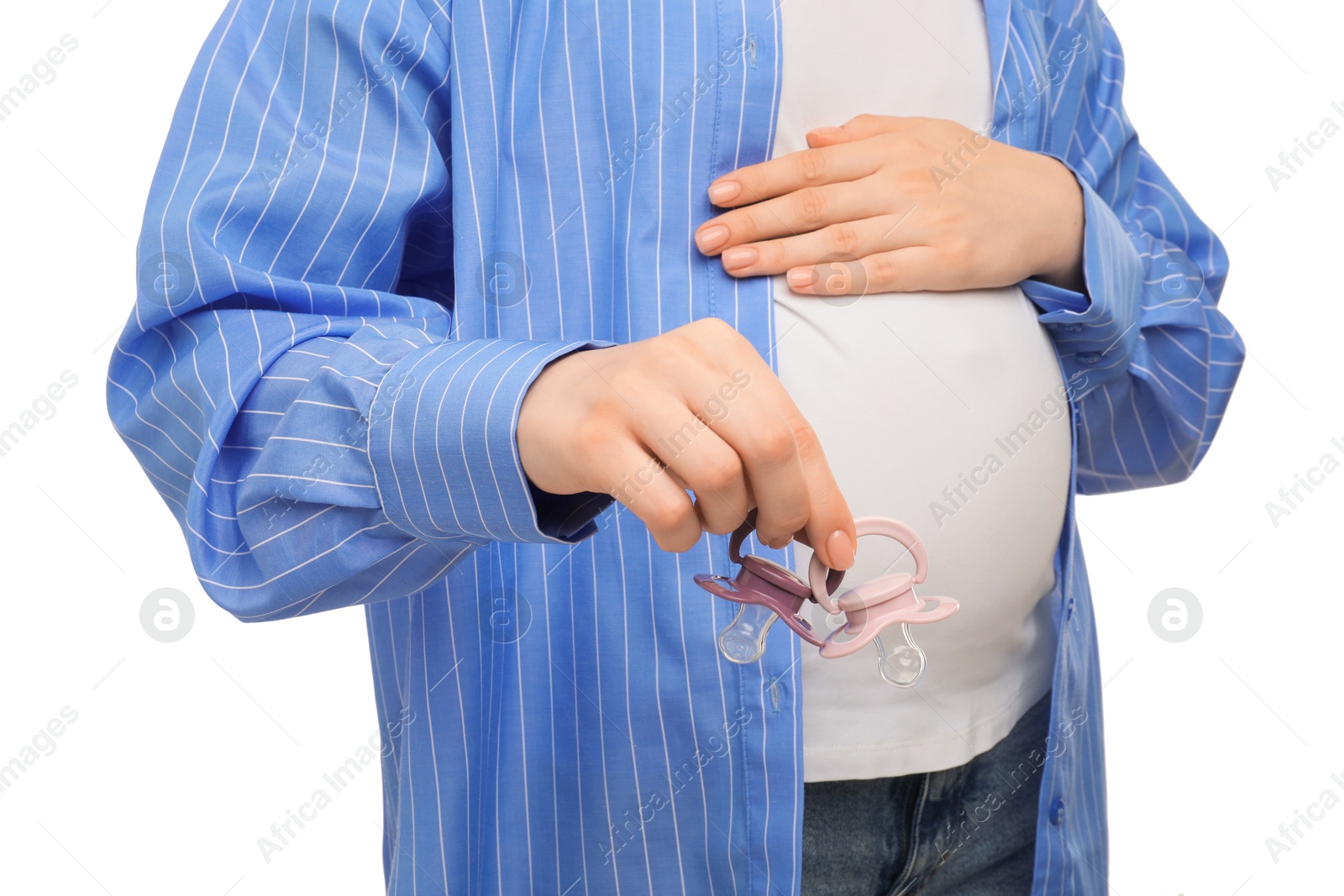 Photo of Expecting twins. Pregnant woman holding two pacifiers on white background, closeup