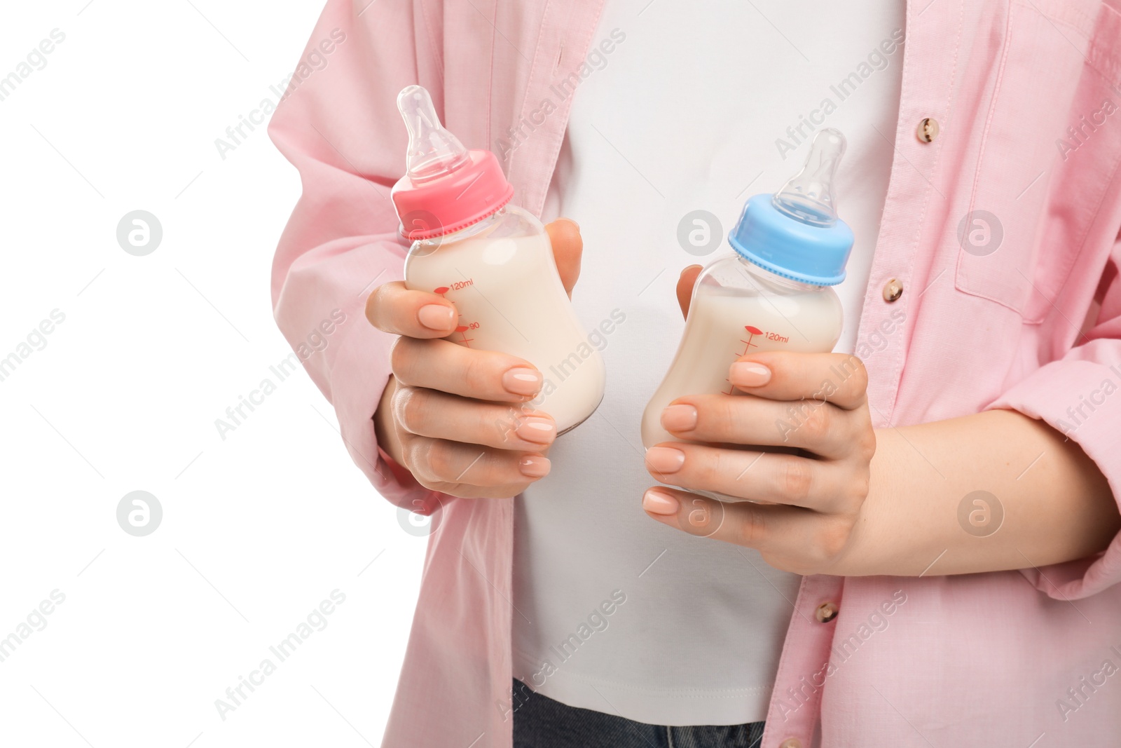 Photo of Expecting twins. Pregnant woman holding two bottles with milk on white background, closeup