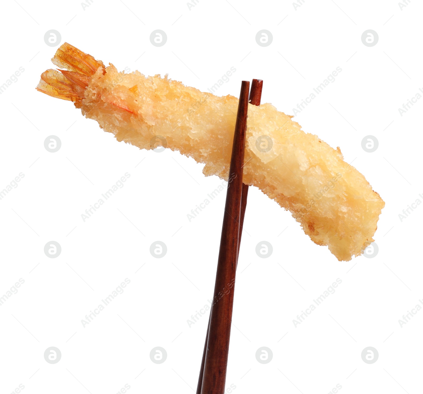 Photo of Chopsticks with delicious breaded fried shrimp isolated on white