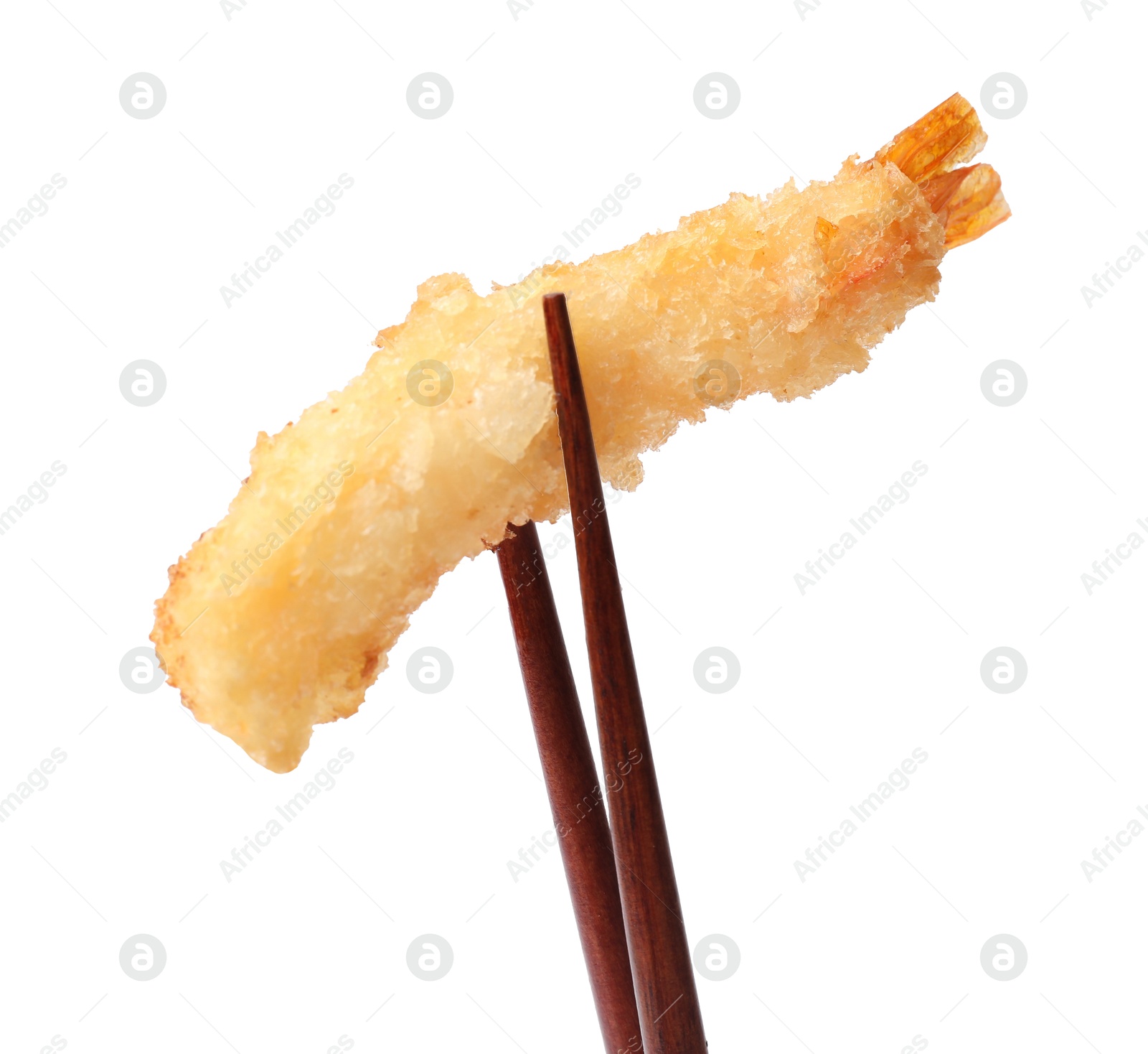 Photo of Chopsticks with delicious breaded fried shrimp isolated on white