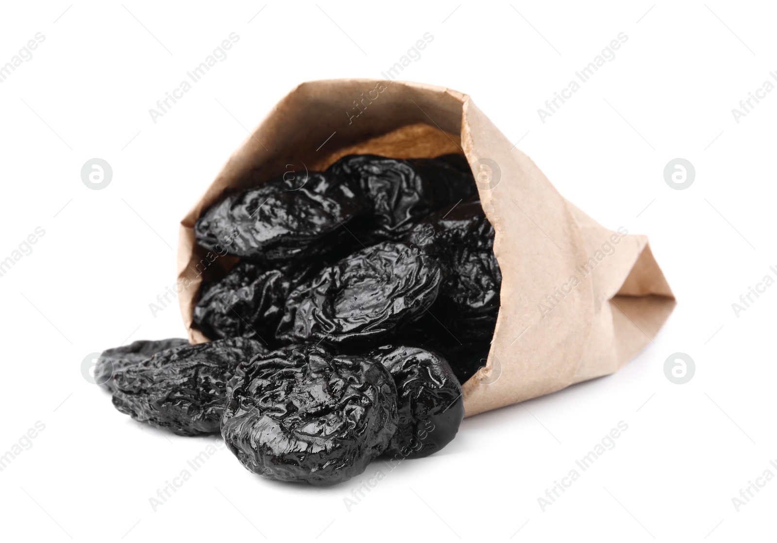 Photo of Paper bag with tasty dried plums (prunes) isolated on white