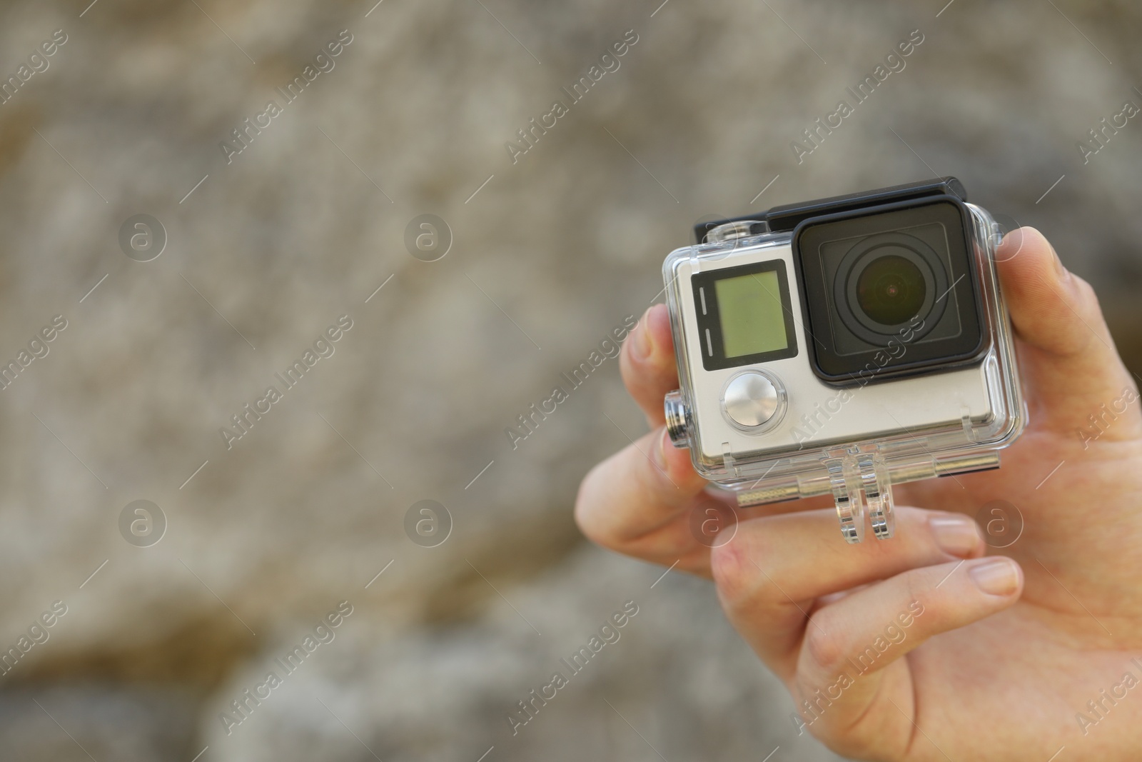 Photo of Man with modern action camera outdoors, closeup. Space for text