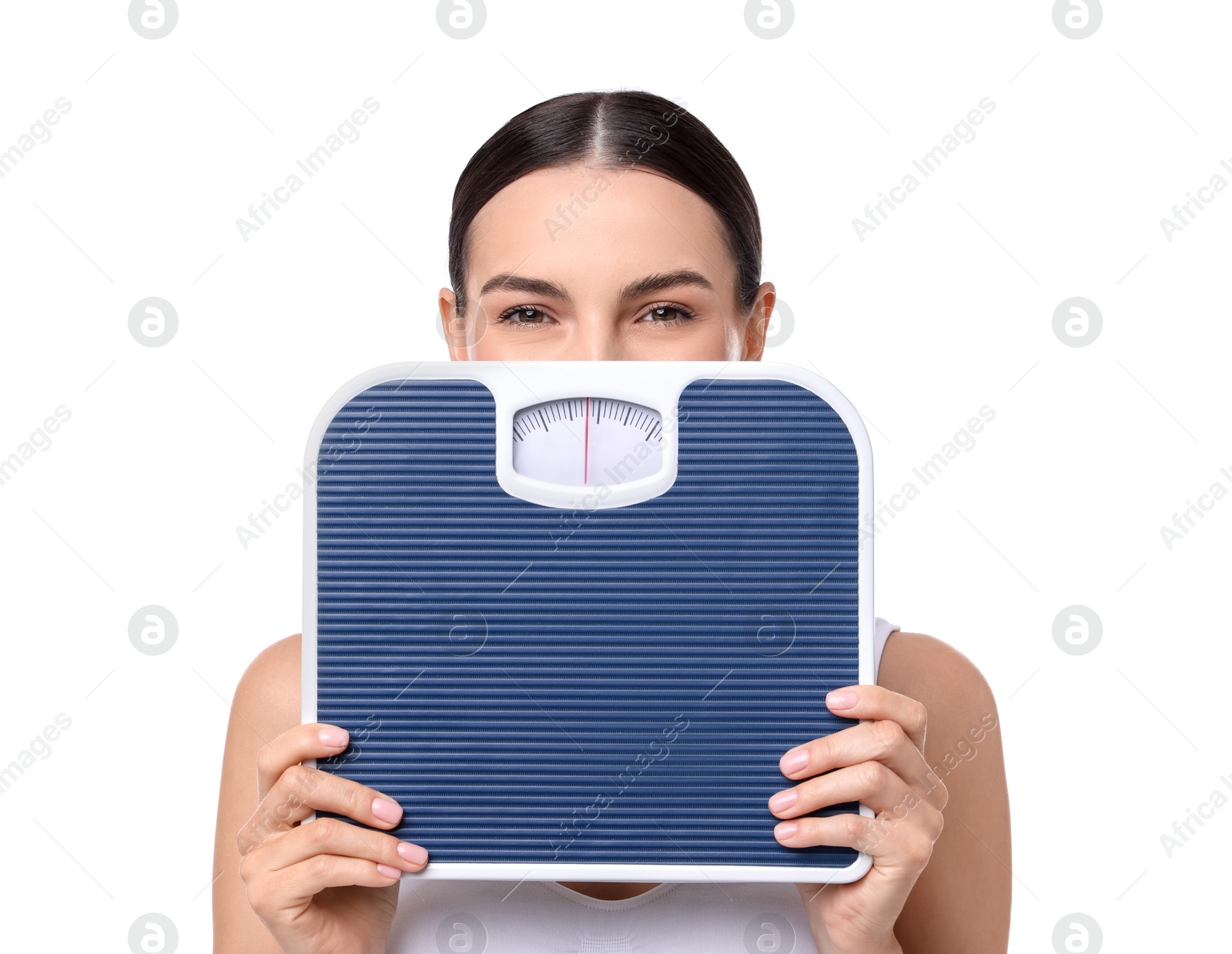 Photo of Diet and weight loss concept. Young woman with floor scale on white background