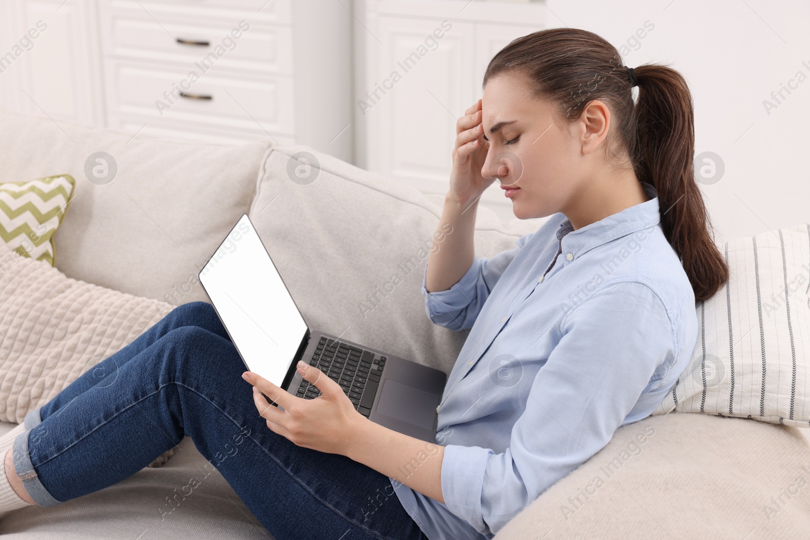 Photo of Sick woman having online consultation with doctor via laptop at home