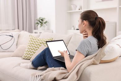 Photo of Sick woman having online consultation with doctor via laptop at home