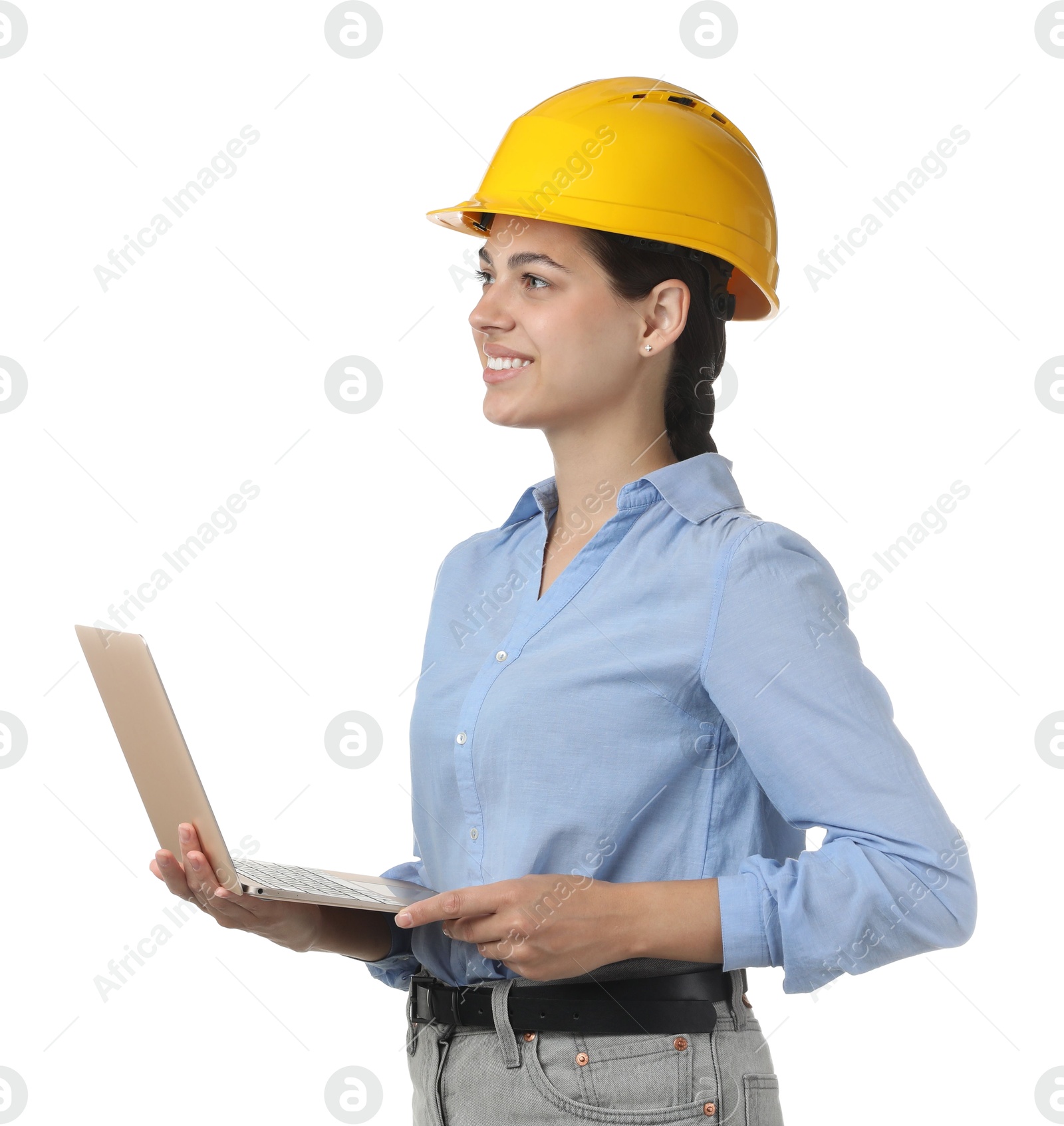 Photo of Engineer in hard hat with laptop on white background