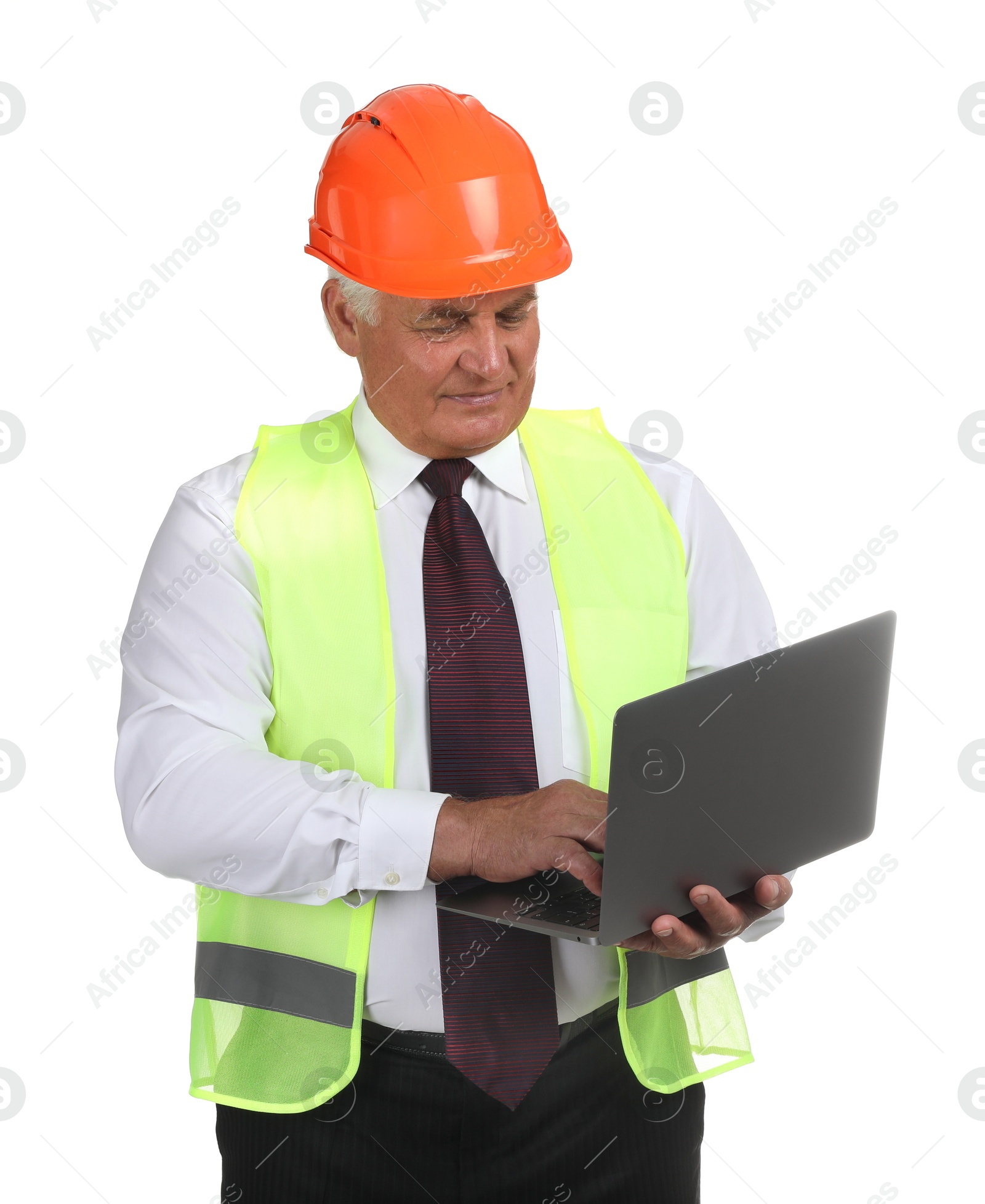 Photo of Engineer in hard hat with laptop on white background