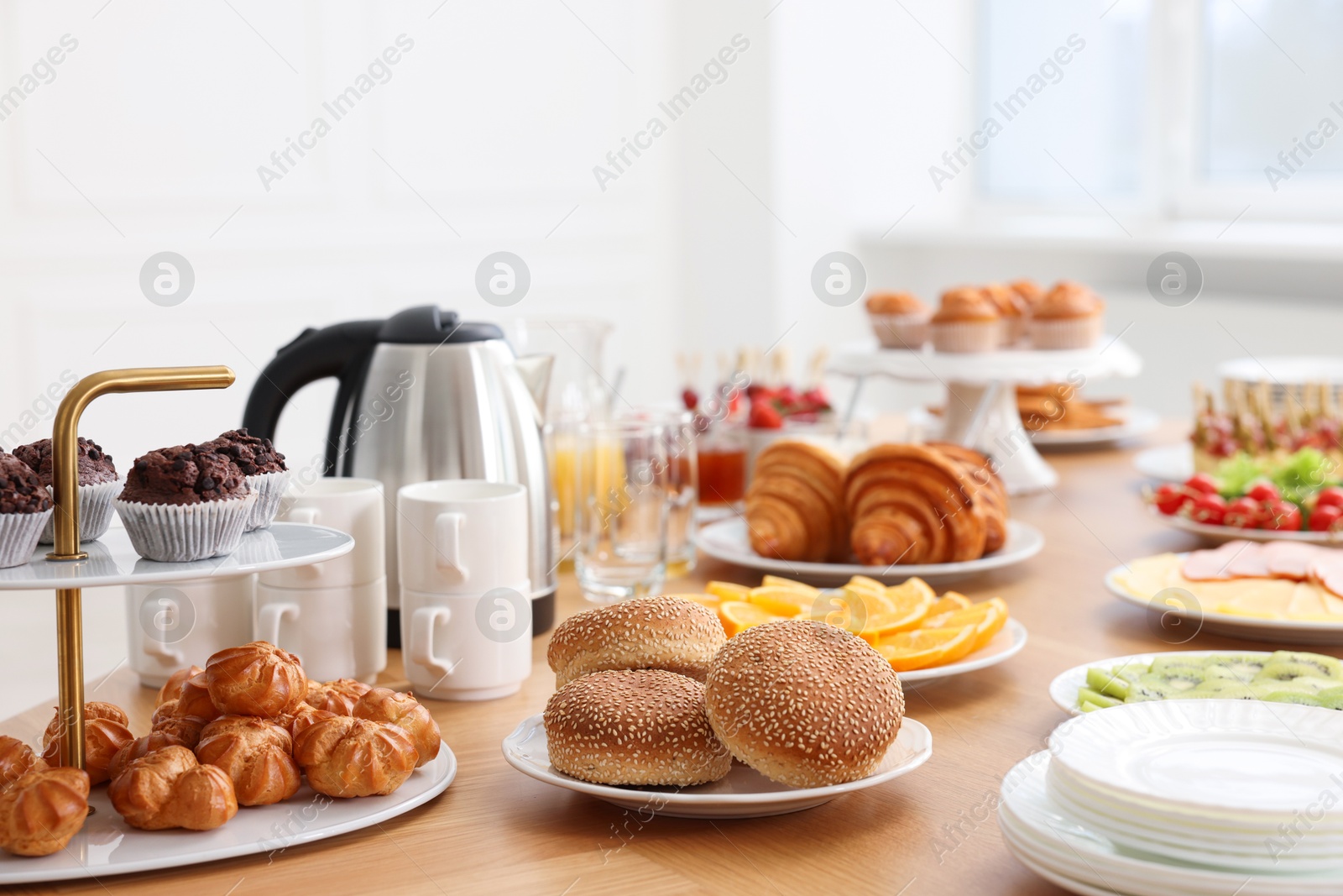 Photo of Different meals served on wooden table indoors. Buffet menu