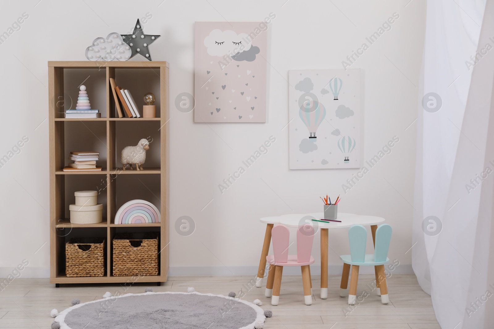 Photo of Child's room interior with modern furniture and beautiful pictures on wall