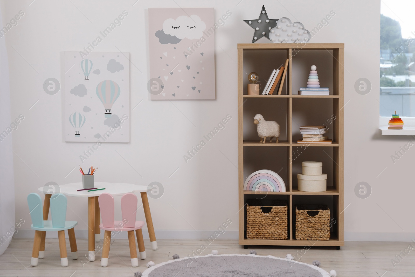 Photo of Child's room interior with modern furniture and beautiful pictures on wall